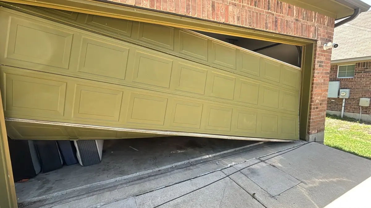 Garage door hanging crooked and unable to close, before emergency repair